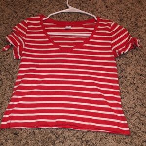 striped shirt with ties on the sleeves